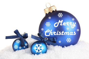 Wall Mural - Beautiful blue Christmas balls on snow, isolated on white