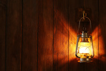 Lantern Hanging On Hook On Wooden Wall