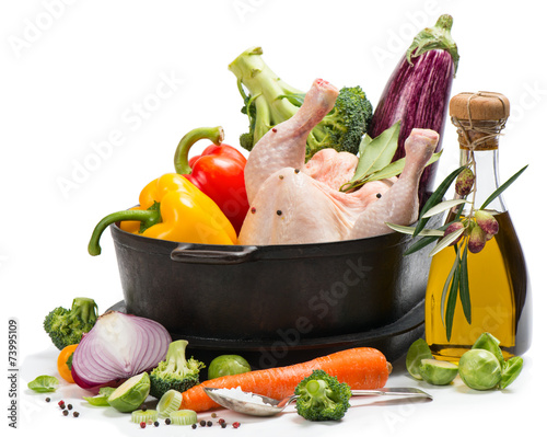 Nowoczesny obraz na płótnie Preparing roast chicken with vegetables on white