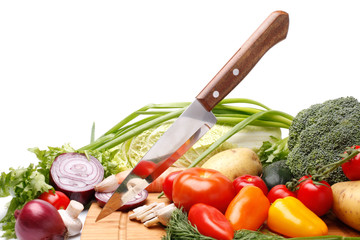 Wall Mural - Fresh vegetables with knife on white background