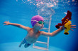 © Ermolaev Alexandr - child dives into the pool for a toy