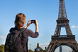 © Song_about_summer - tourist in Paris, woman taking photo of Eiffel Tower