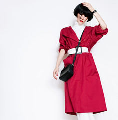 glamorous lady in fashionable red vintage coat on a white backgr