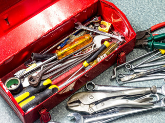 Well used old tools and red tool box