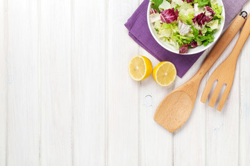 Poster - Fresh healthy salad and kitchen utensils