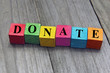 concept of donation word on wooden cubes