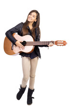 Portrait Of Happy Teenager Playing Guitar