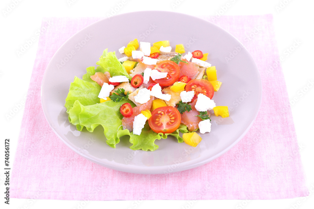 Appetizing fish salad with vegetables on plate isolated on