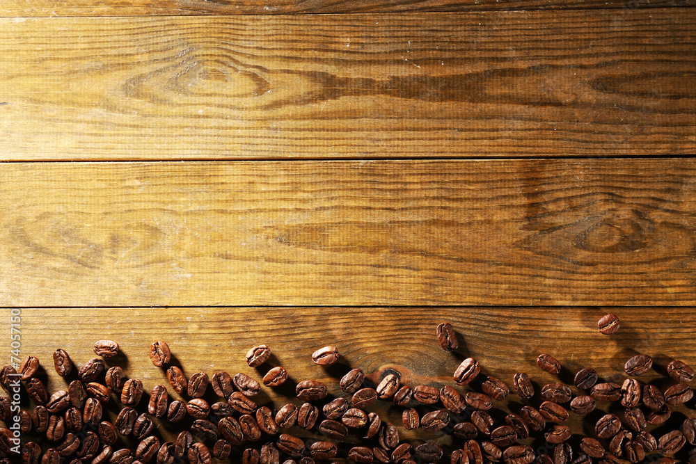 Coffee beans on wooden background