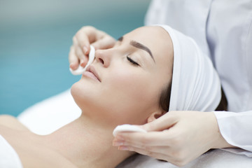 spa, resort, beauty and health concept - beautiful woman in spa