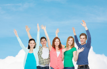 Wall Mural - group of smiling students waving hands