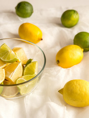 Wall Mural - Lemons and limes on the white background