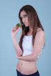 © Domforstock - Healthy and elegant young woman, holding a kiwi with straw
