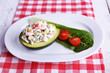 Tasty salad in avocado on plate table close-up