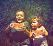 © annette shaff - two kids eating watermelon done with a retro vintage instagram f