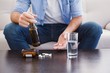 © WavebreakMediaMicro - Close up of man showing pills and holding bottle