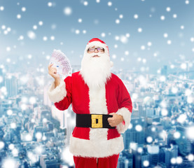 Canvas Print - man in costume of santa claus with euro money