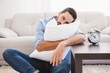 © WavebreakMediaMicro - Exhausted man sleeping with head resting on pillow
