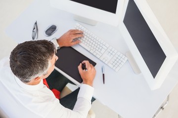 Poster - Businessman using digital tablet and computer