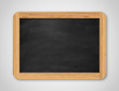 © gearstd - Blank black chalkboard. Background and texture.