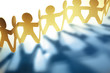 © Stillfx - Teamwork paper chain people together holding hands