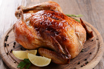 Canvas Print - Delicious baked chicken on table close-up