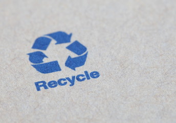 Blue recycle sign on a paper box product