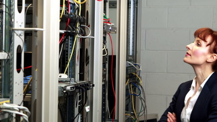 Poster - Technician looking at open server locker
