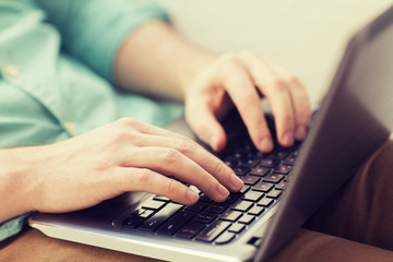 Poster - close up of man working with laptop at home