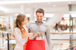 © Syda Productions - happy young couple with shopping bags in mall