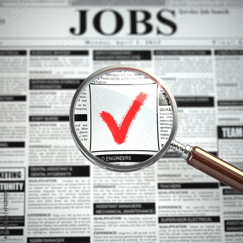 Fototapeta na wymiar Job search concept. Loupe, newspaper with employment advertiseme