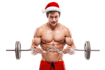 Wall Mural - Muscular bodybuilder Santa Claus doing exercises with dumbbells