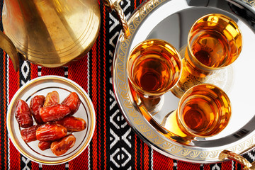 Iconic Abrian fabric tea and dates symbolise Arabian hospitality