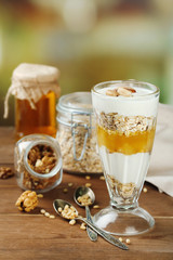 Canvas Print - Tasty dessert with oat flakes and honey, on table