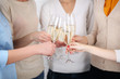 © Africa Studio - Woman hands with glasses of champagne