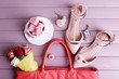 Women bag stuff on wooden background top view