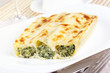 Cannelloni with spinach and ricotta baked in sauce bechamel