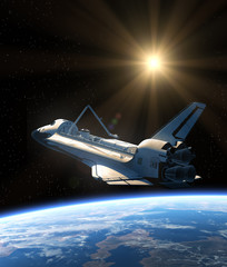 Wall Mural - space shuttle orbiting earth