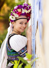 Wall Mural - Beautiful woman in national folk costume