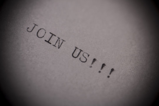 old typewriter with text join us