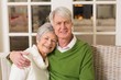 © WavebreakmediaMicro - Portrait of smiling mature couple at table