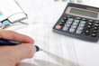© thodonal - Businesswoman checking financial documents