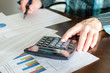 © thodonal - Female accountant checking financial documents