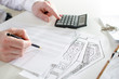 © thodonal - Realtor analyzing financial planning of a house