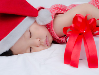 Wall Mural - Sleeping baby girl Santa Claus