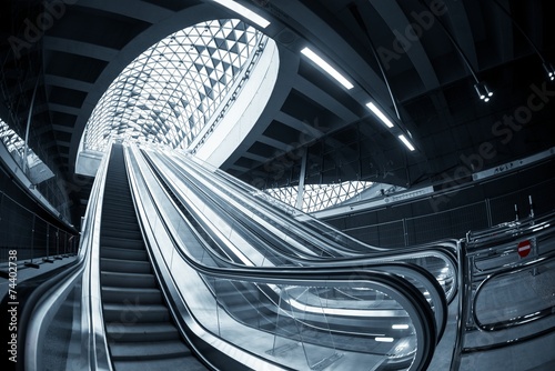 Moving escalator in the business center Poster Mural XXL