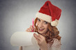 © pathdoc - woman with christmas hat is posing in studio writing gift ideas