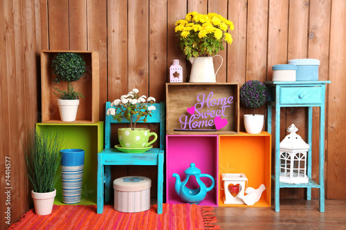 фотографія Beautiful colorful shelves with different home related objects