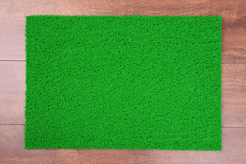 Wall Mural - Green carpet on floor close-up