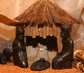 Wall Mural - Nativity scene with Holy Family in a manger in Africa